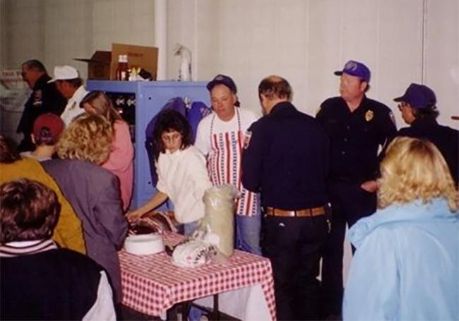 People standing at Elizabeth Fire chili dinner