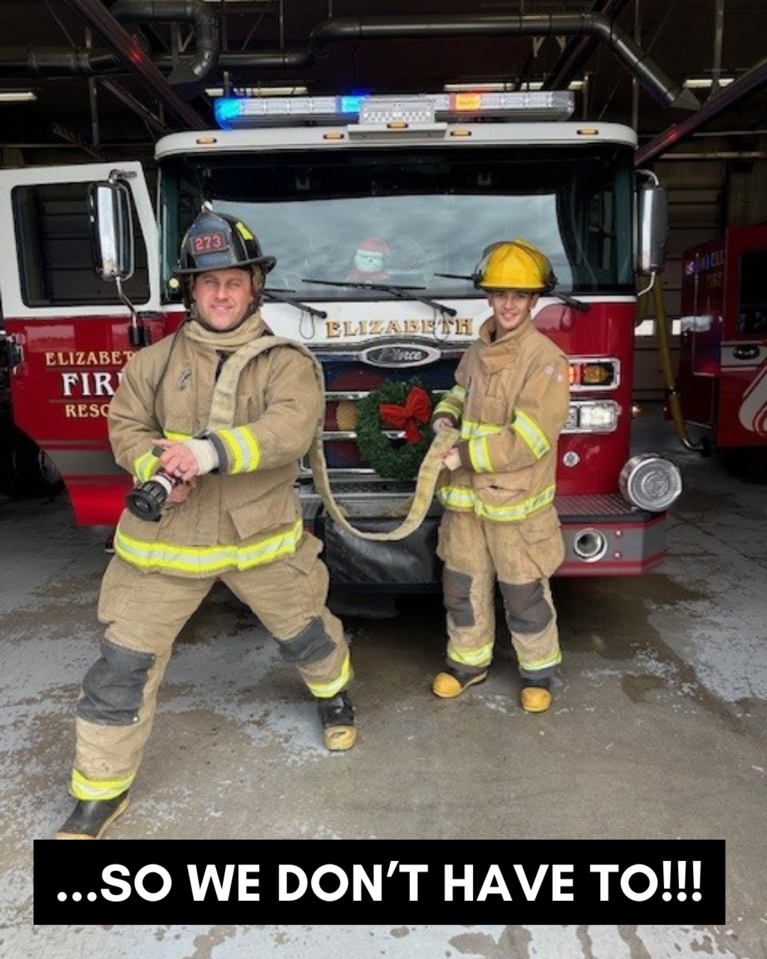 Two firefighters in bunker gear in front of a fire engine with the caption "...So We Don't Have To."