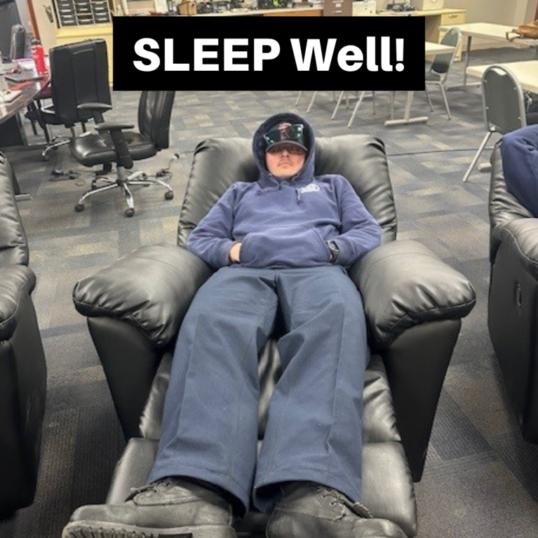 A firefighter sleeping on a reclining chair with the caption "SLEEP Well!"