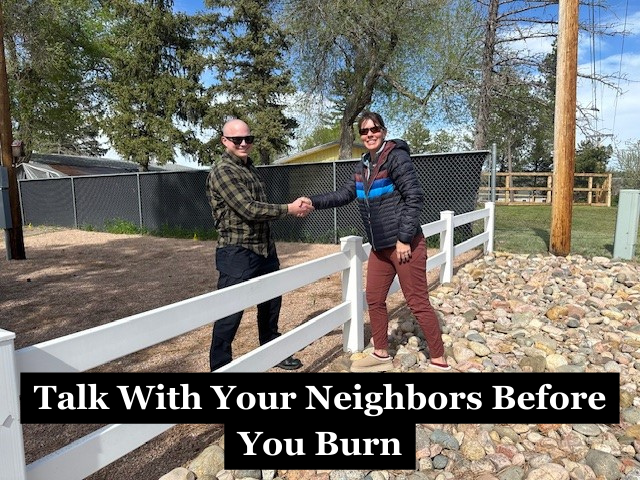Two people shaking hands over a fence with the caption "Talk With Your Neighbors Before You Burn"