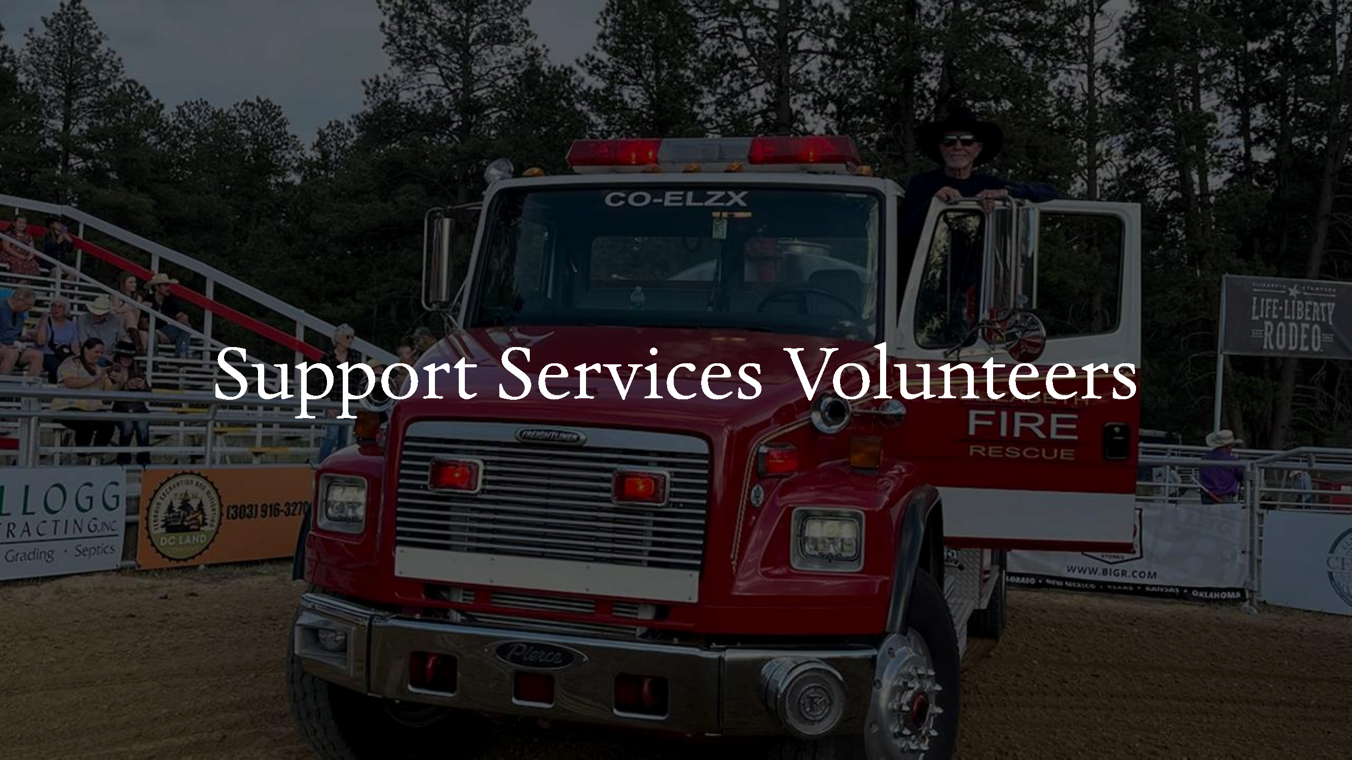 A support services volunteer standing with an EFPD Tender at the Elizabeth Stampede