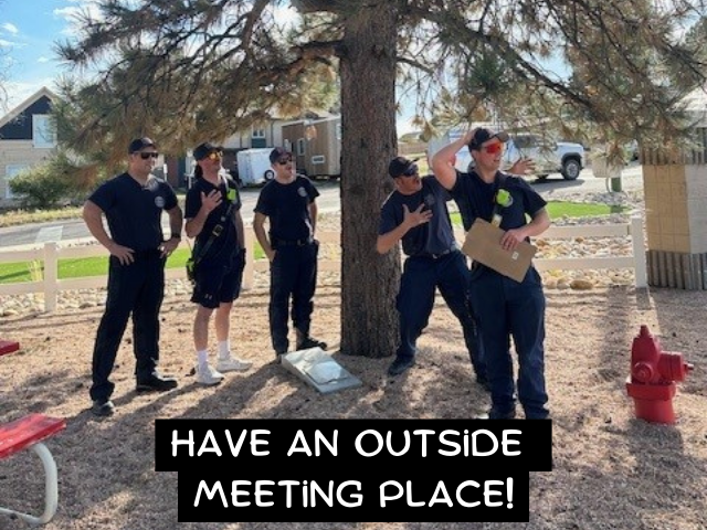 Firefighters standing by a tree with the caption "Have an Outside Meeting Place!"