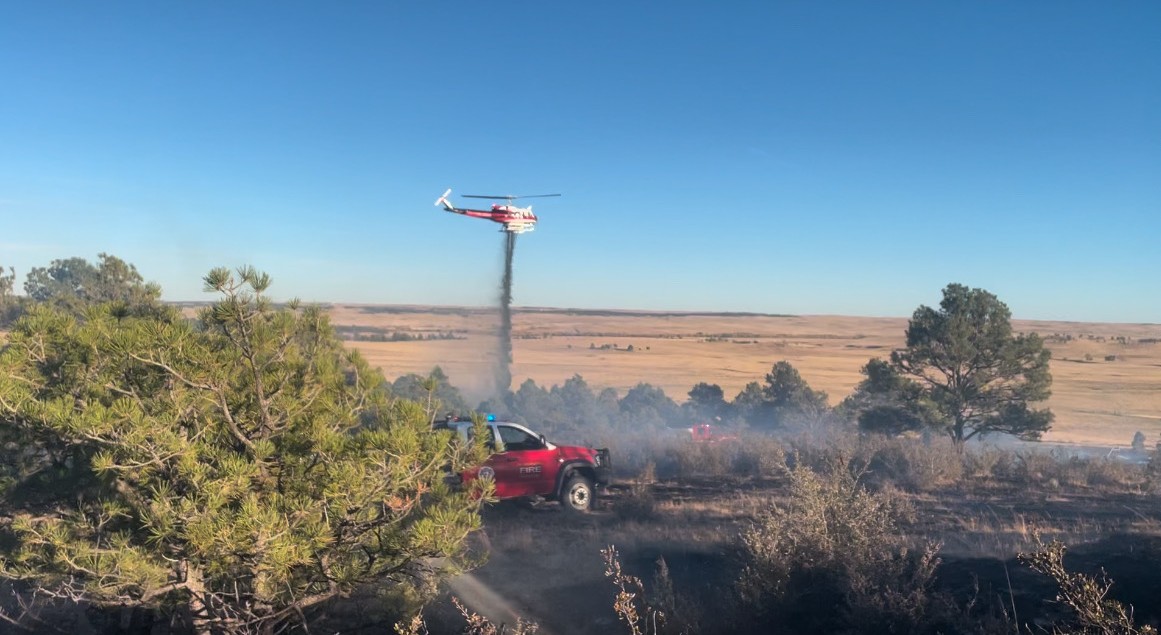 EFPD apparatus on calls throughout the year - brush truck and helicopter on fire scene