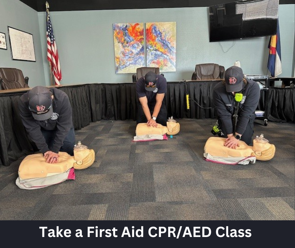 Firefighters performing CPR compressions on mannequins with the caption "Take a First Aid CPR/AED Class"