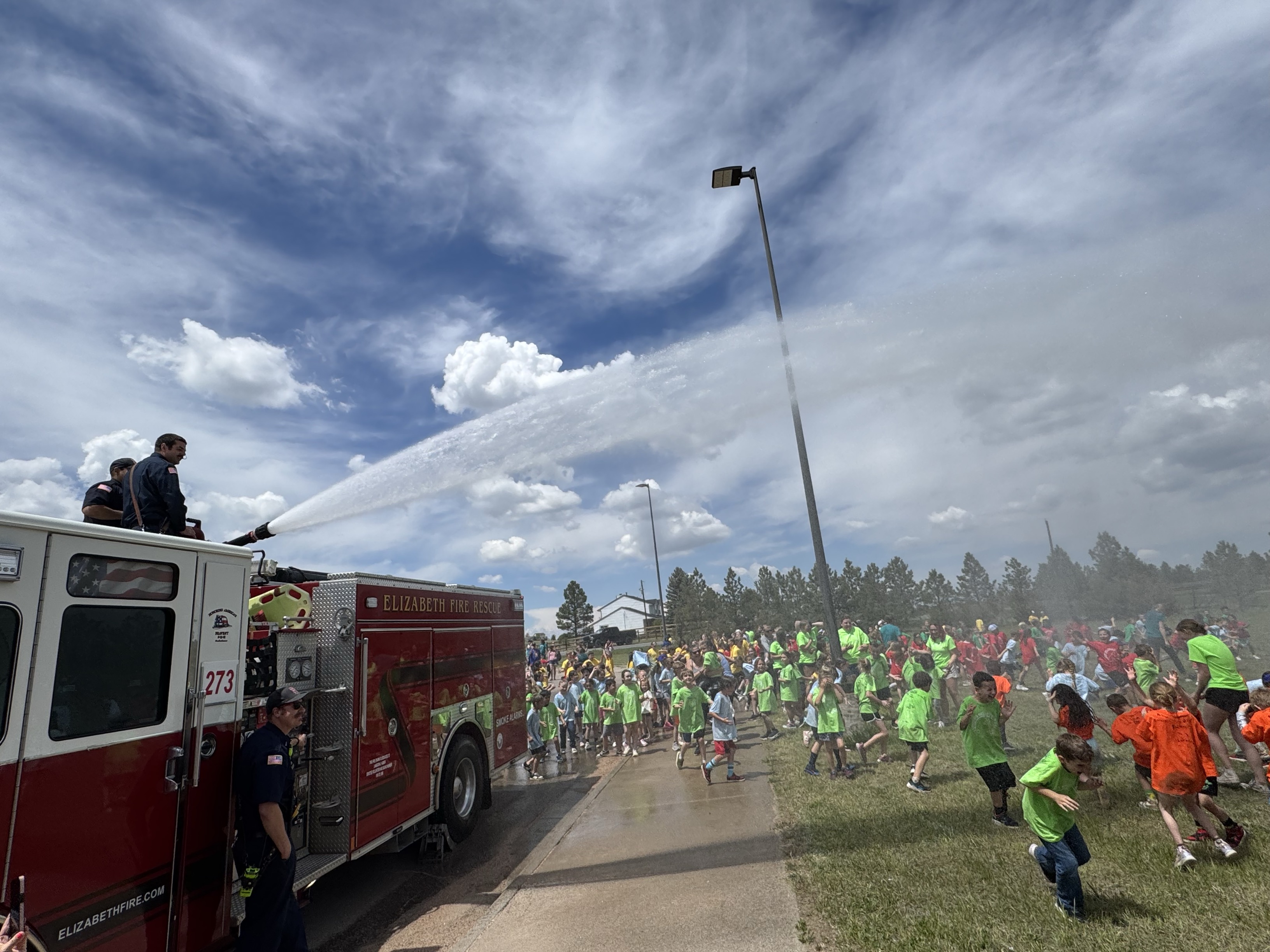 Station 273 crews spraying water at Singing Hills Elementary’s Field Day