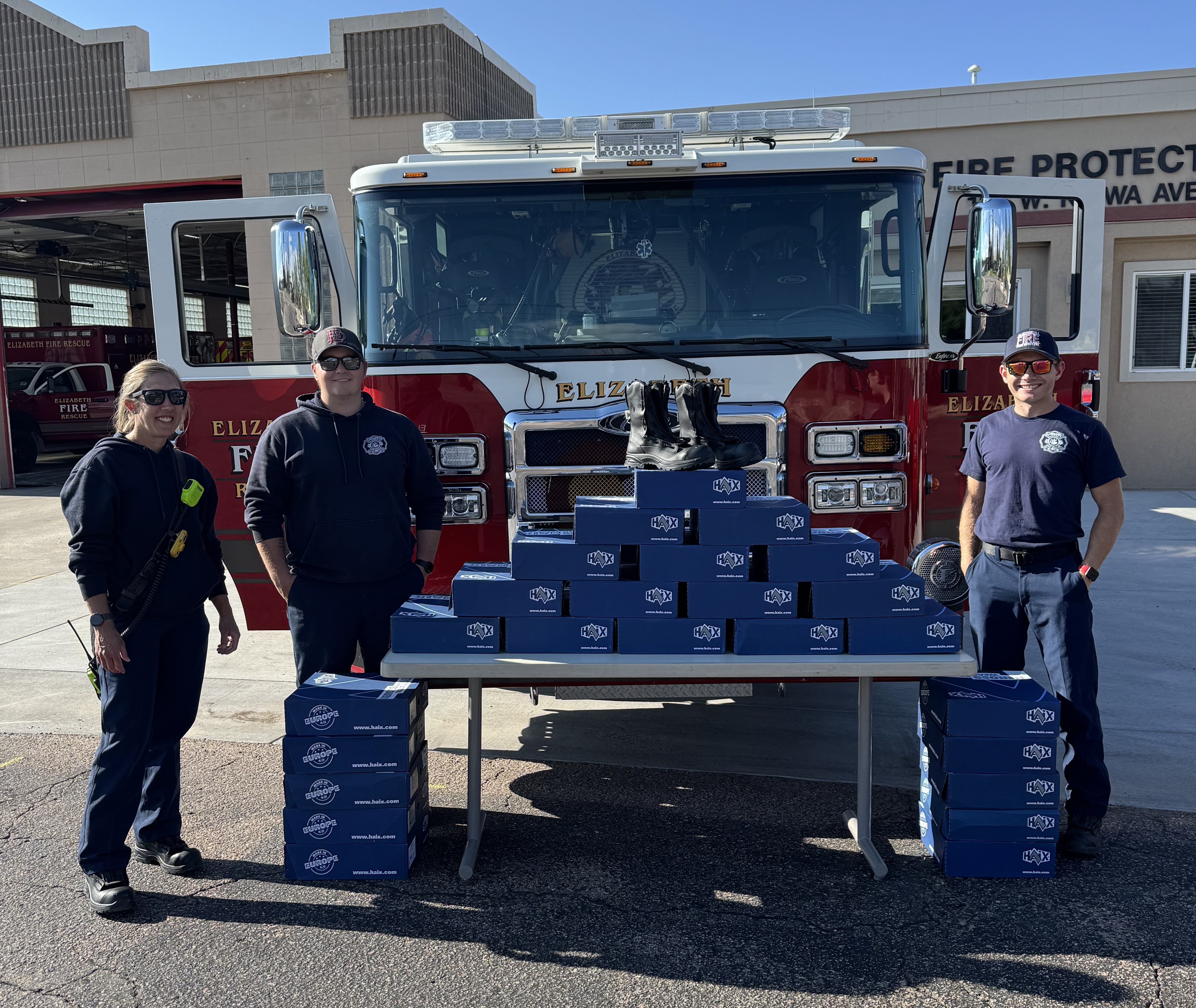 Crews standing beside the wildland boots