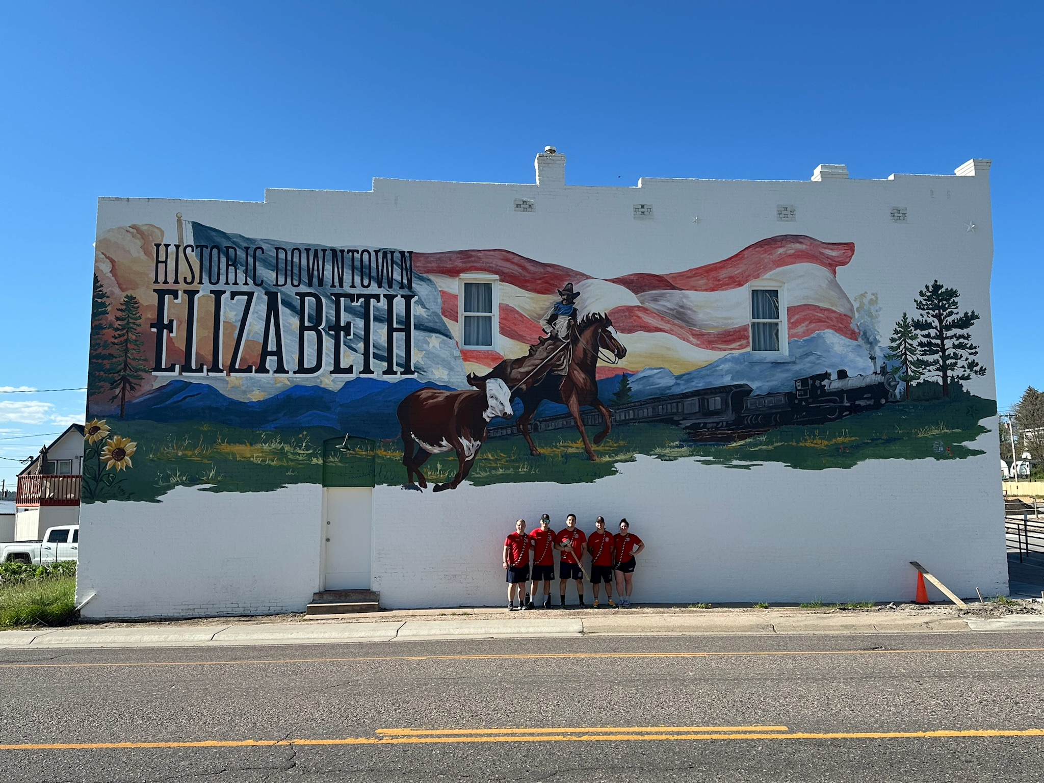 Academy recruits in front of the new mural in downtown Elizabeth