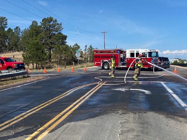 Crews spraying water during a car accident