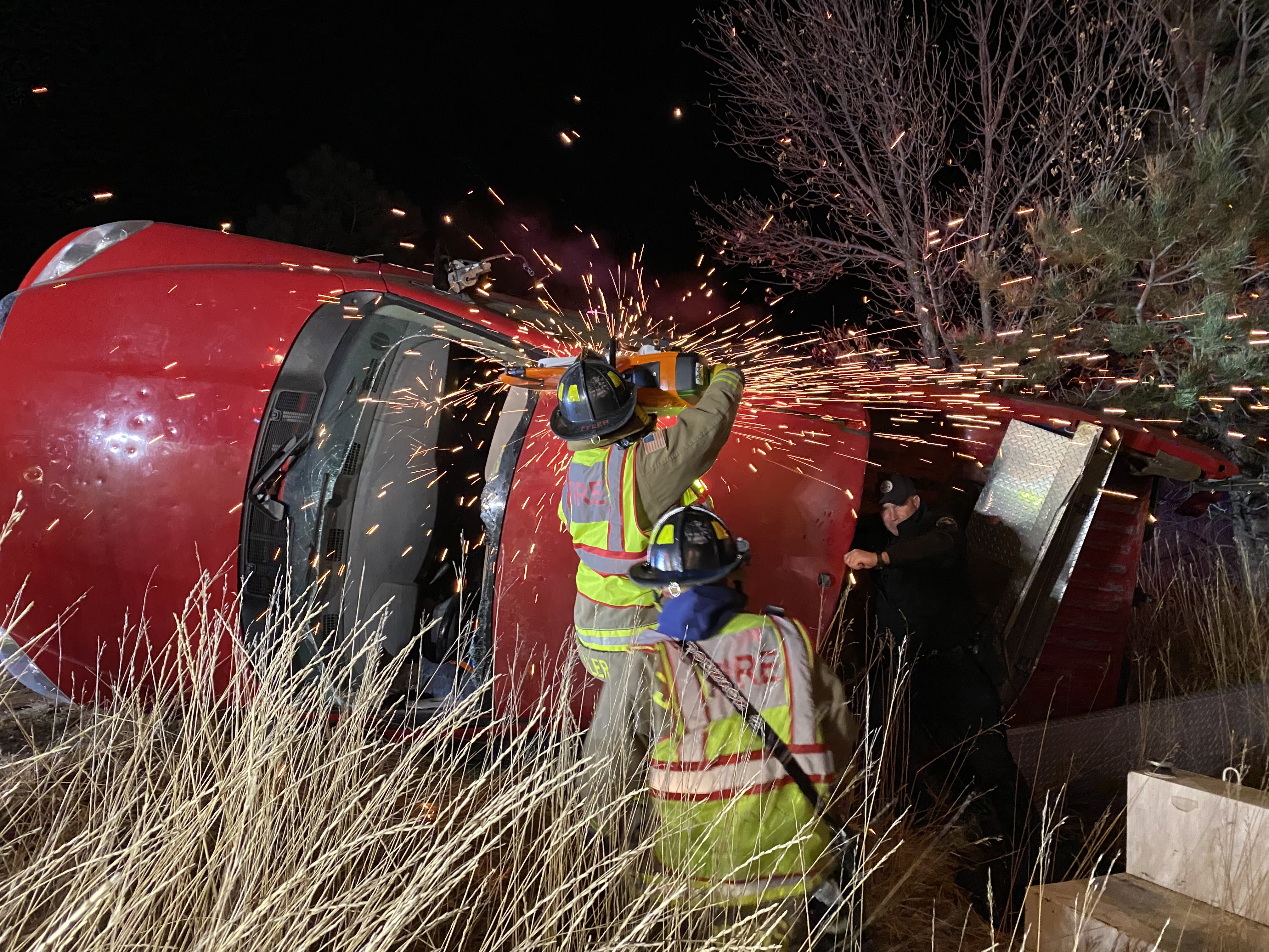 Crews performing extrication on a car