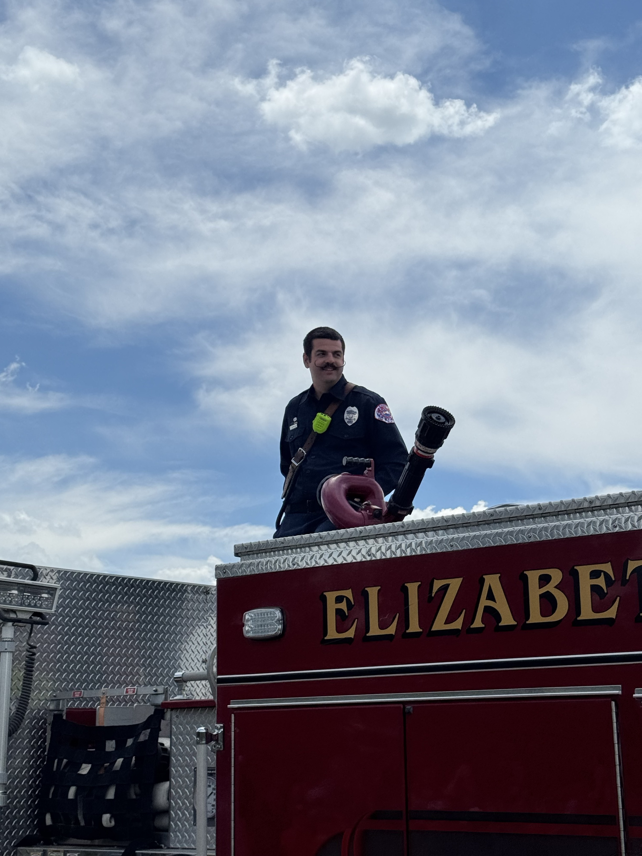 A firefighter using a hose
