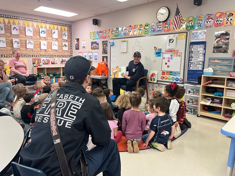 Photo of crews reading to the schools