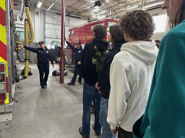 Photo of crews giving a station tour