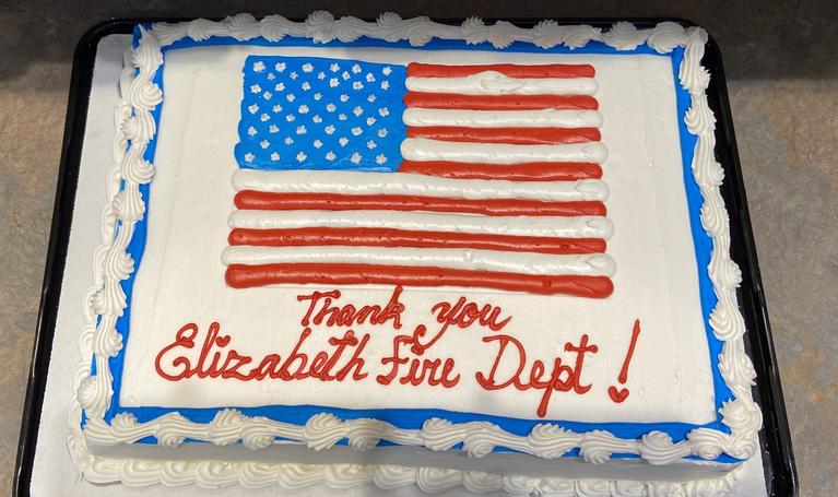 Photo of a cake with the words “Thank you, Elizabeth Fire Dept!” on it delivered to the crews from the grateful family of a patient
